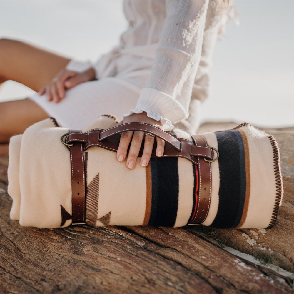 The Anifurry Thunderbird Merino Wool Blanket is stored using a Blanket Carry Strap.